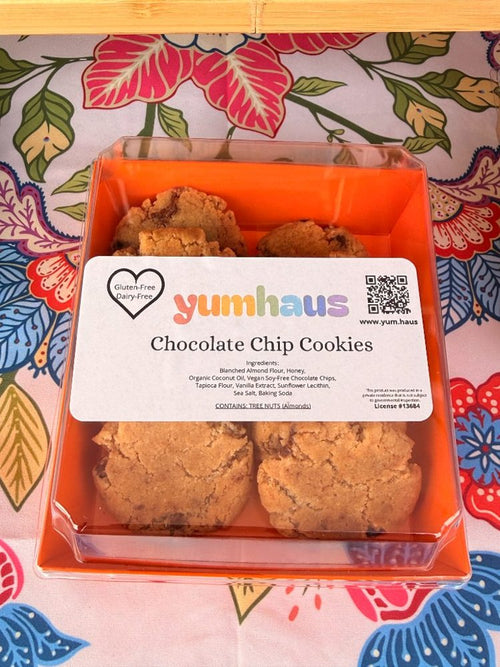A box of Yumhaus gluten-free, dairy-free Chocolate Chip cookies in an orange gift box