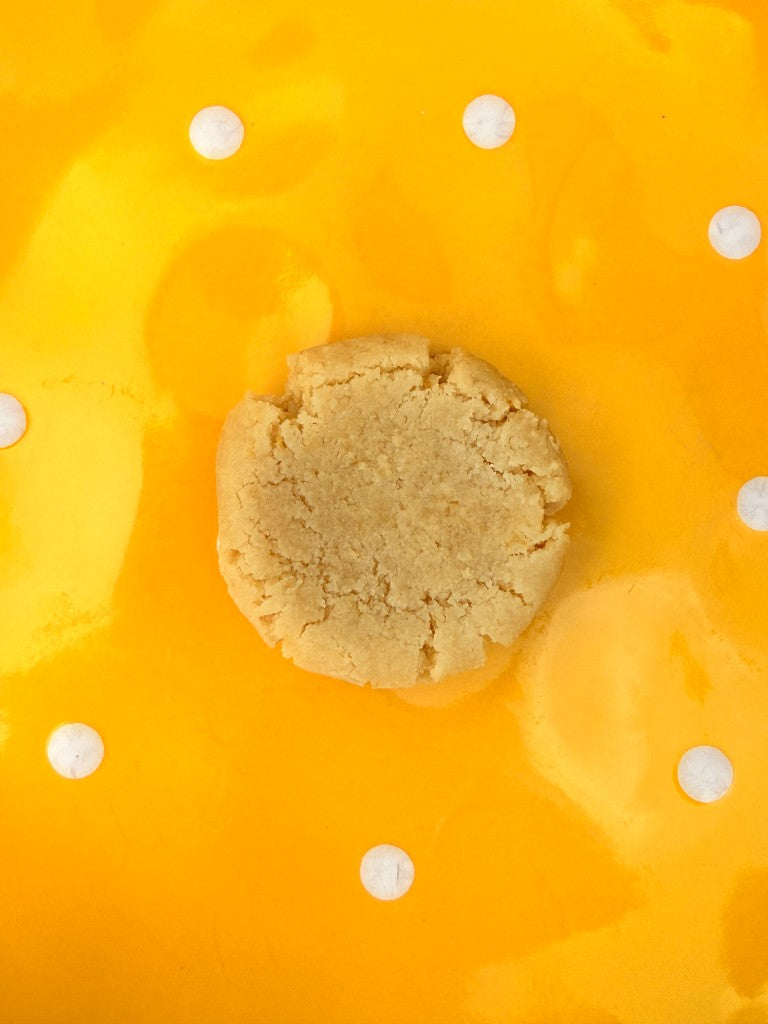 Lemon Love cookie on a yellow polka-dot background