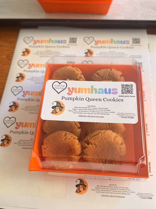 A box of Yumhaus Pumpkin Queen gluten-free, dairy-free pumpkin pie cookies in an orange gift box